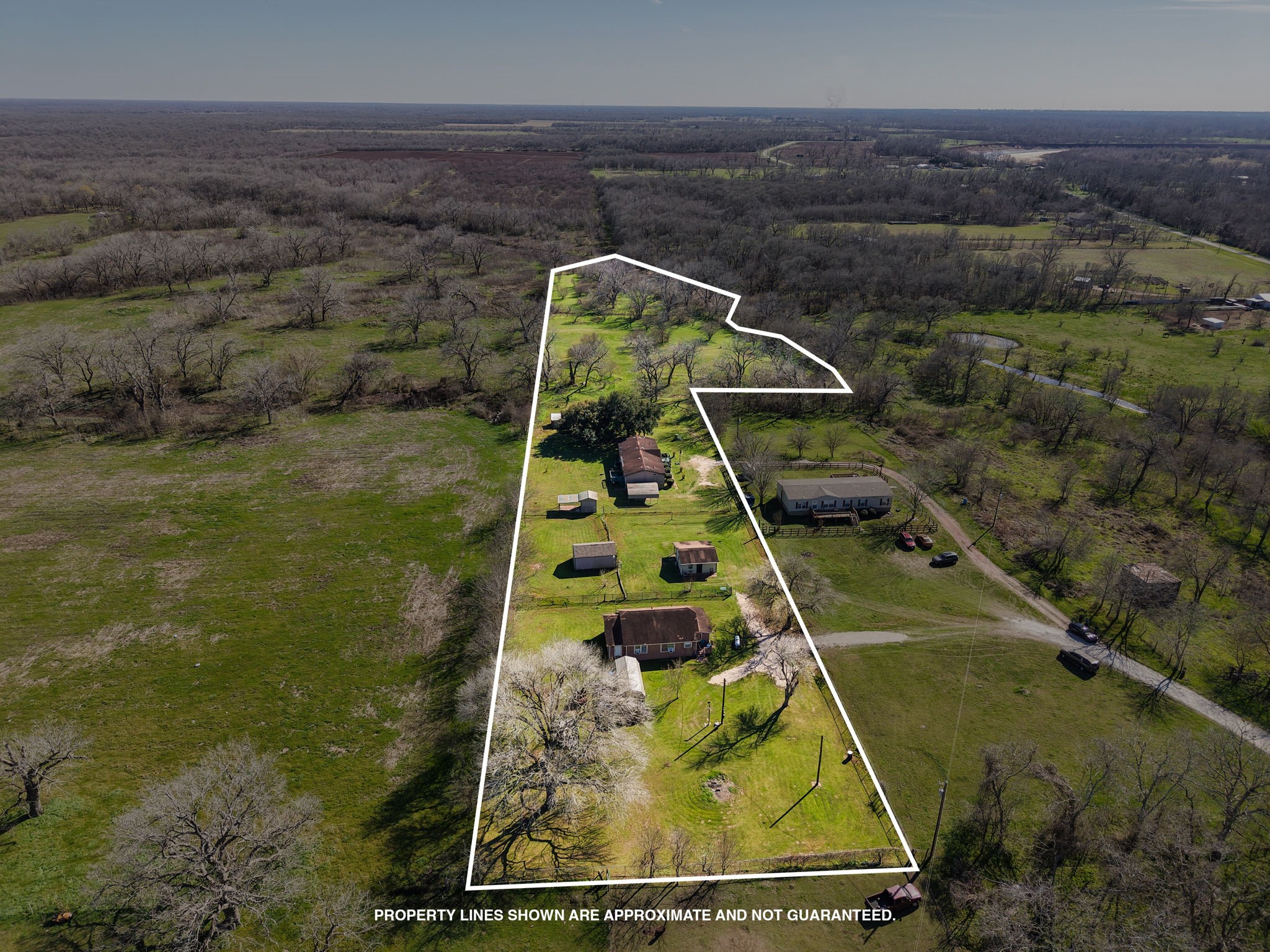 7610 Moore Road Pattison, TX 77423 - Photo 40 of 40 a bird sitting on top of a field