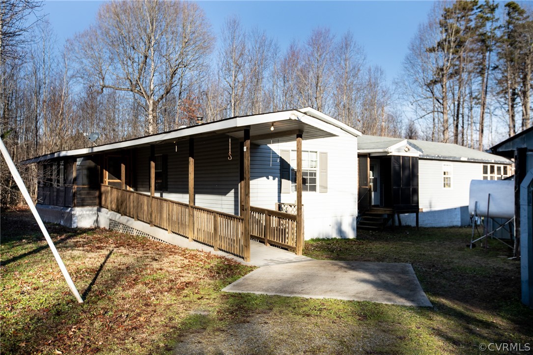 2625 Turkey Island Road Crewe, VA 23930 - Photo 1 of 45 a front view of a house with garden