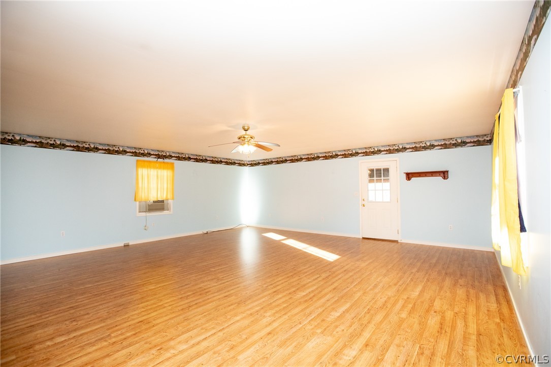 2625 Turkey Island Road Crewe, VA 23930 - Photo 16 of 45 a view of a big room with wooden floor and a window