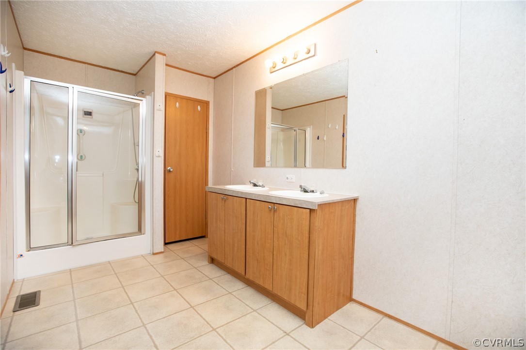 2625 Turkey Island Road Crewe, VA 23930 - Photo 21 of 45 a bathroom with a sink a mirror and a shower