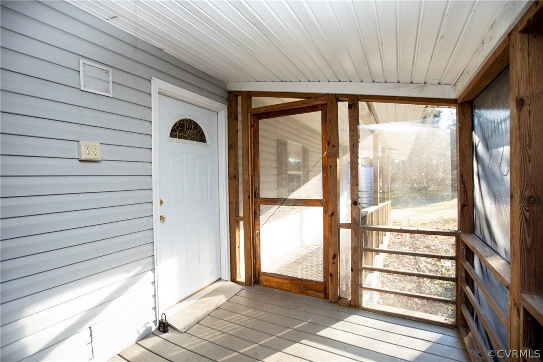 2625 Turkey Island Road Crewe, VA 23930 - Photo 5 of 45 a view of a porch with wooden floor and a table