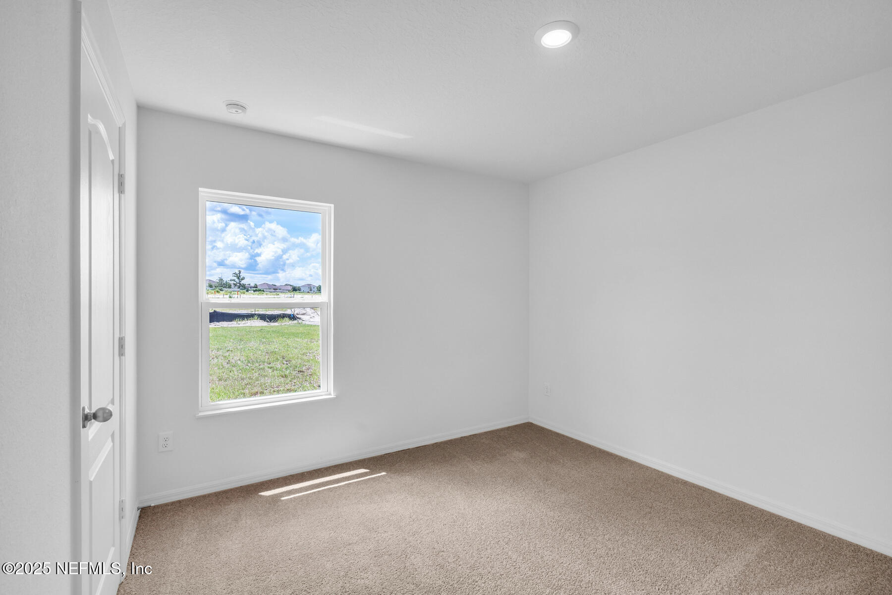 37338 Whisper Way Hilliard, FL 32046 - Photo 11 of 14 an empty room with a window