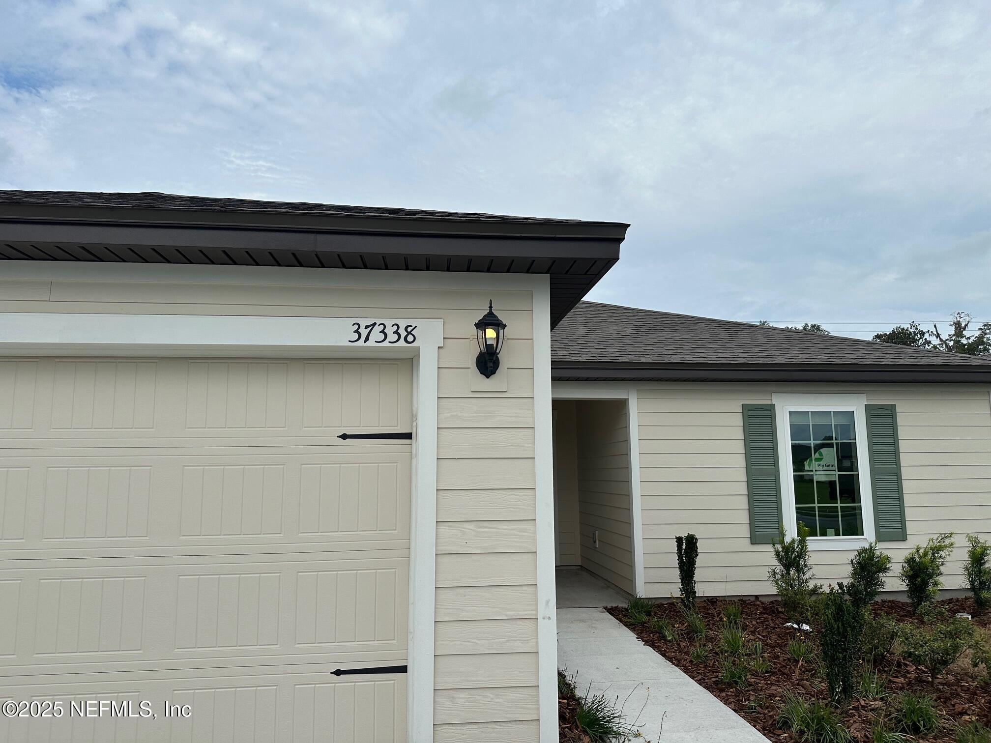 37338 Whisper Way Hilliard, FL 32046 - Photo 2 of 14 a view of backyard of the house
