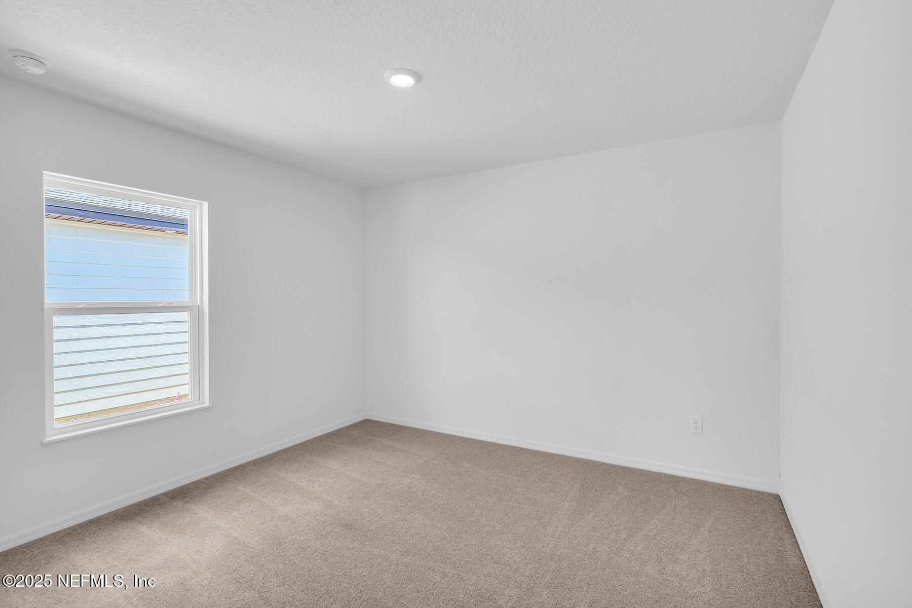37338 Whisper Way Hilliard, FL 32046 - Photo 8 of 14 an empty room with windows