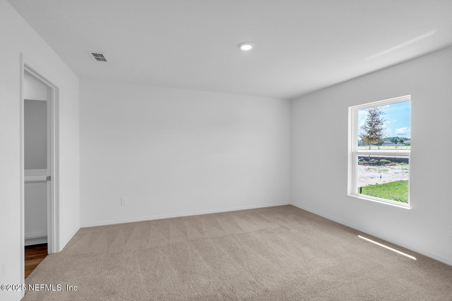 37338 Whisper Way Hilliard, FL 32046 - Photo 9 of 14 an empty room with windows