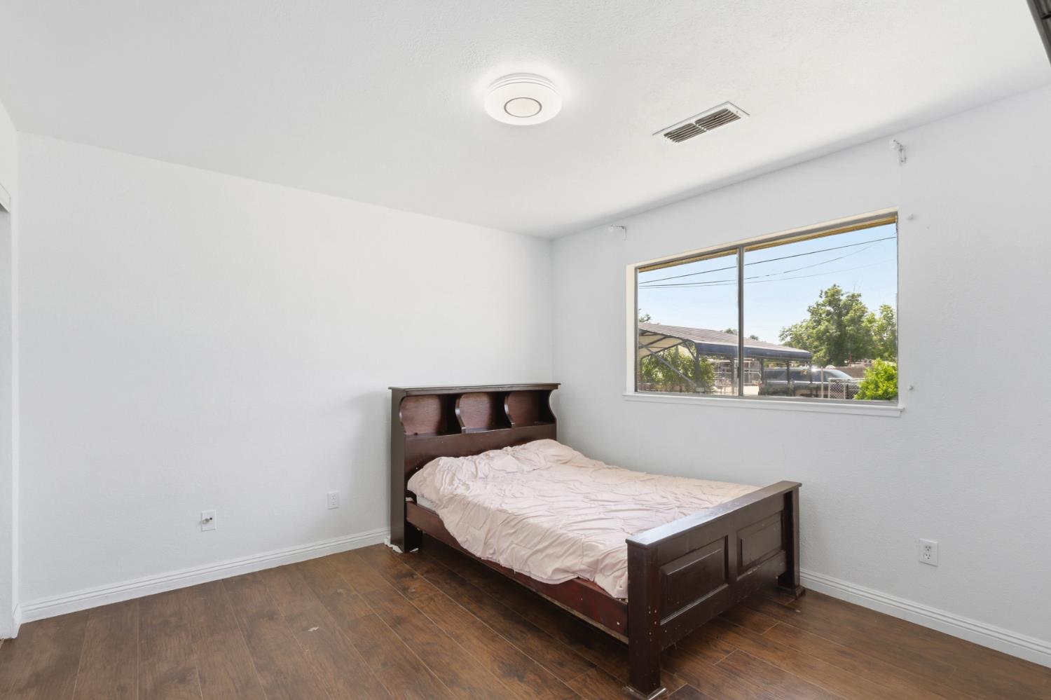 7208 7th Street Rio Linda, CA 95673 - Photo 23 of 41 a bedroom with a bed and window