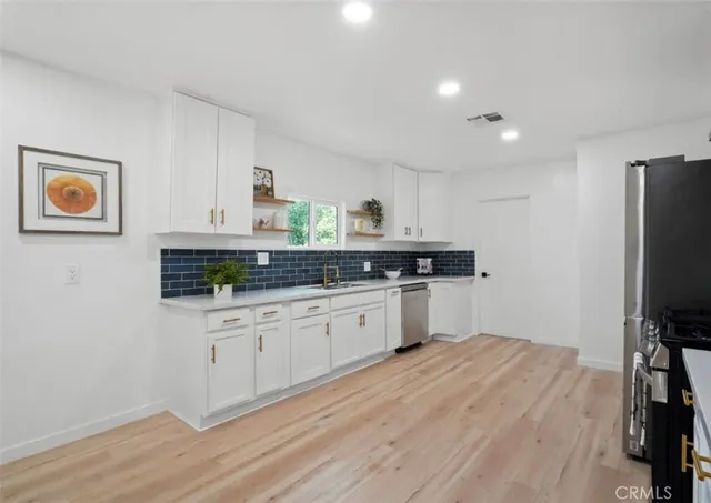 a bedroom with a bed and a chair