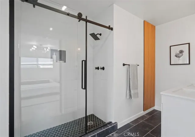 a bedroom with a bed and dresser