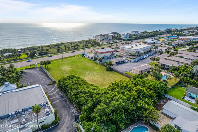 an aerial view of a house with a garden