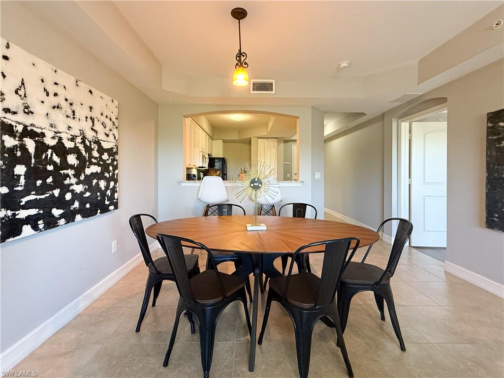 1100 Pine Ridge Road, Unit B405 Naples, FL 34108 - Photo 28 of 43 a dining room with furniture and window
