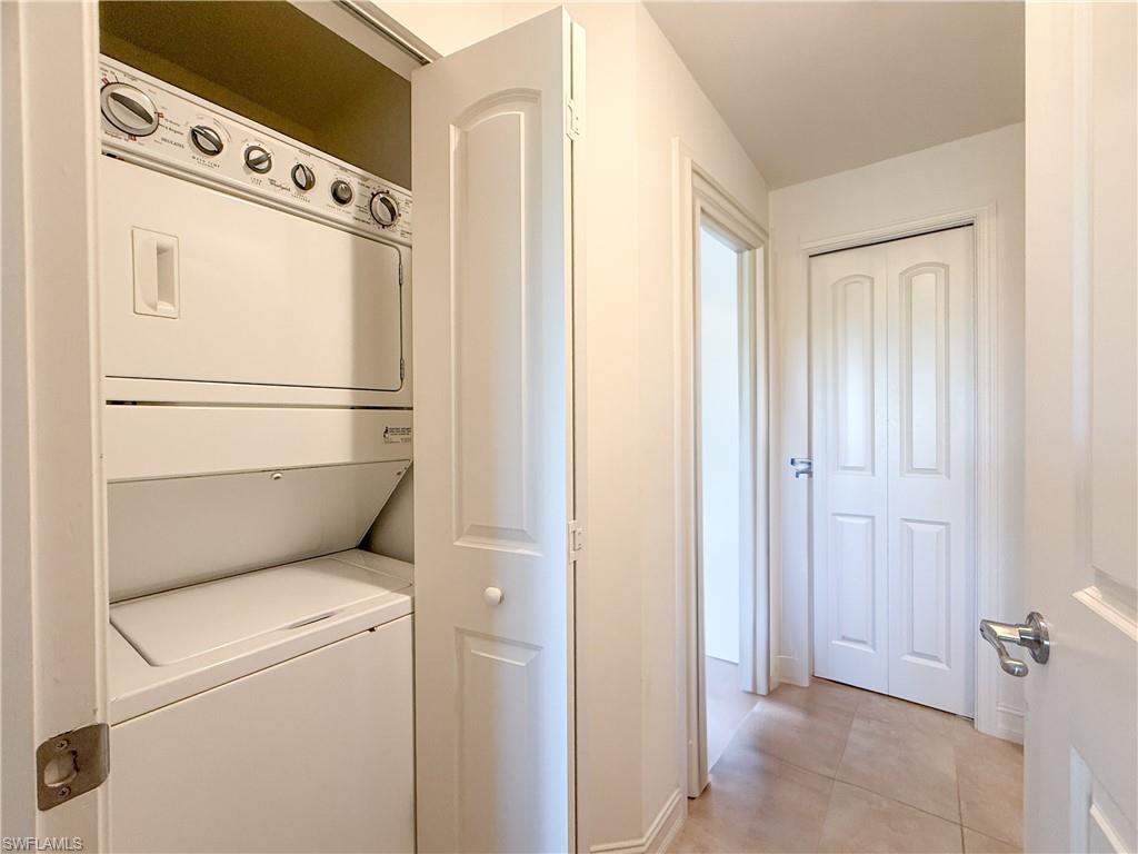 1100 Pine Ridge Road, Unit B405 Naples, FL 34108 - Photo 31 of 43 a utility room with dryer and washer