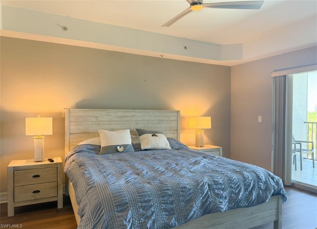 1100 Pine Ridge Road, Unit B405 Naples, FL 34108 - Photo 35 of 43 a bedroom with a bed and a window