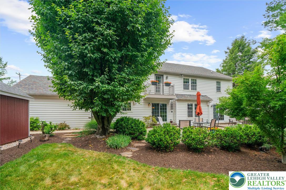 5616 Snowdrift Road Orefield, PA 18069 - Photo 33 of 36 A private, verdant backyard offers a delightful patio for al fresco dining and relaxation.