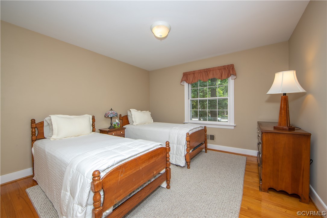 13371 Kingsmill Road Midlothian, VA 23113 - Photo 18 of 43 a bedroom with two beds and a window