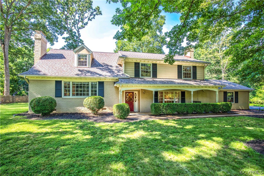 13371 Kingsmill Road Midlothian, VA 23113 - Photo 2 of 43 a front view of a house with a garden and trees
