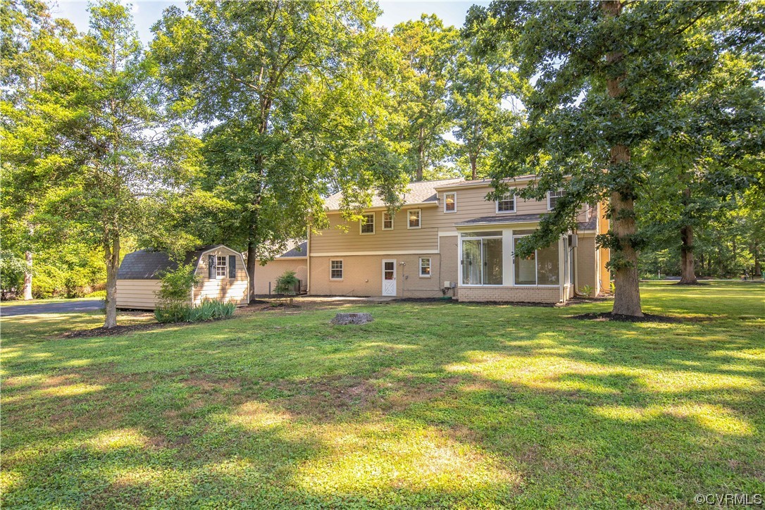 13371 Kingsmill Road Midlothian, VA 23113 - Photo 31 of 43 a view of a house with a big yard and large trees