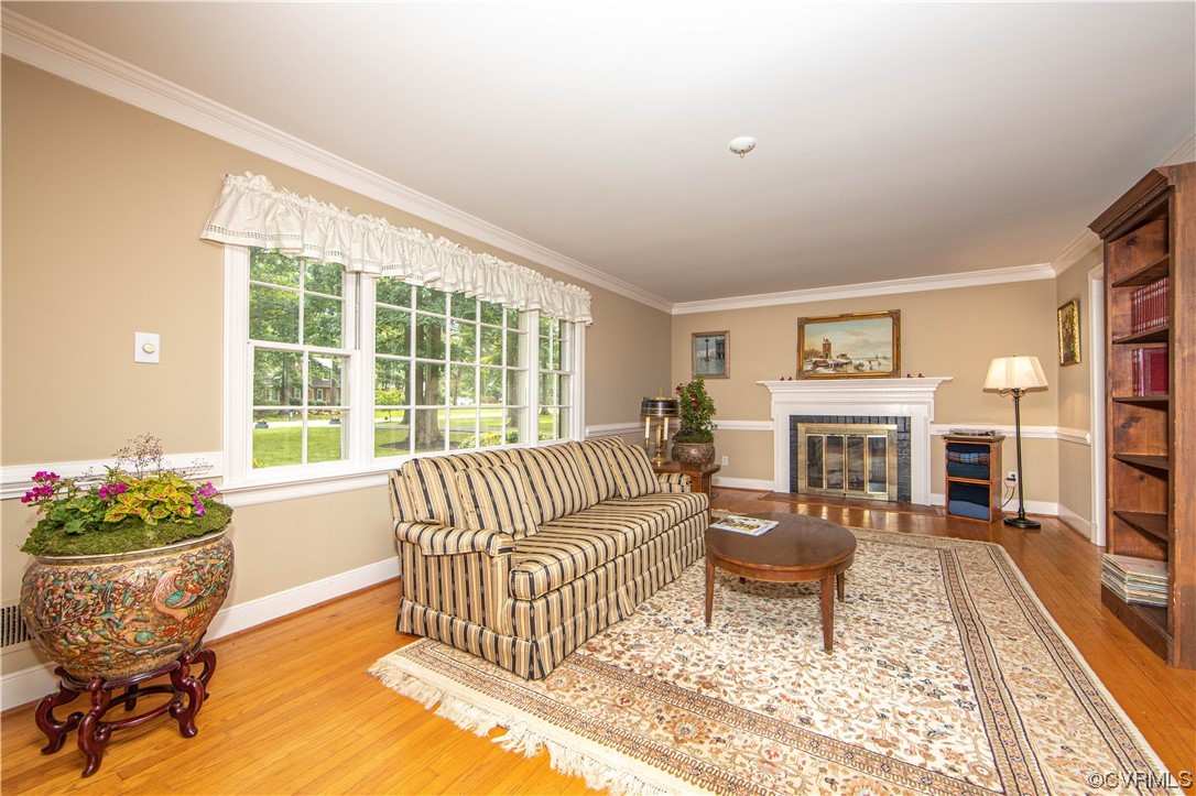13371 Kingsmill Road Midlothian, VA 23113 - Photo 4 of 43 a living room with furniture and a fireplace