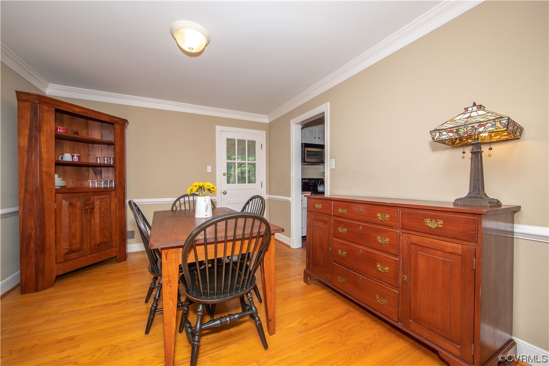 13371 Kingsmill Road Midlothian, VA 23113 - Photo 7 of 43 a view of a dining room with furniture and chandelier