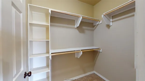 a view of an empty walk in closet