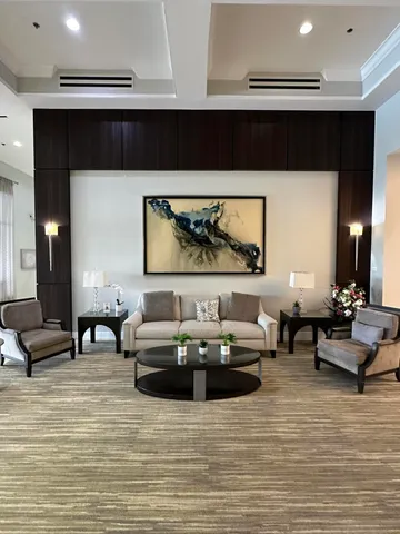 a living room with fireplace furniture and a flat screen tv