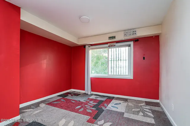 a bathroom with a toilet sink vanity and mirror