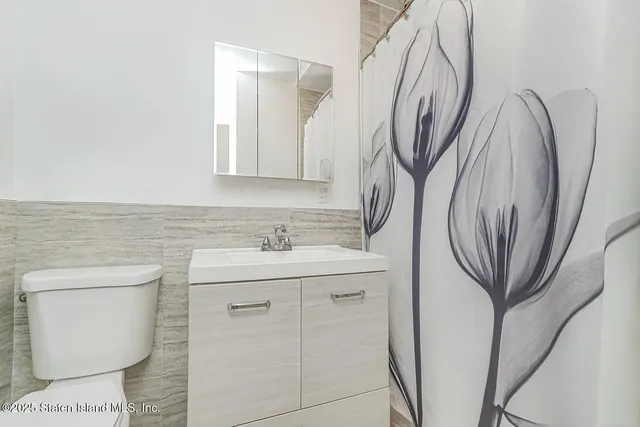 a view of a house with a wooden deck