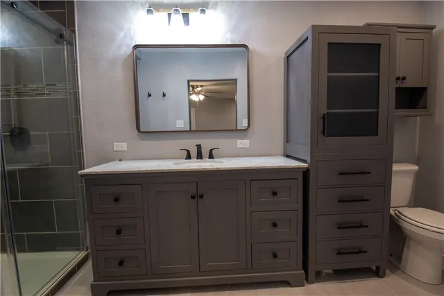 a bathroom with a sink vanity and mirror