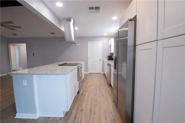 a view of hallway with wooden floor