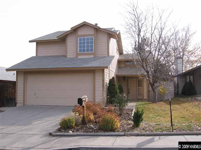 6154 Chesterfield Lane Reno, NV 89523 - Photo 1 of 9 a front view of a house with garden