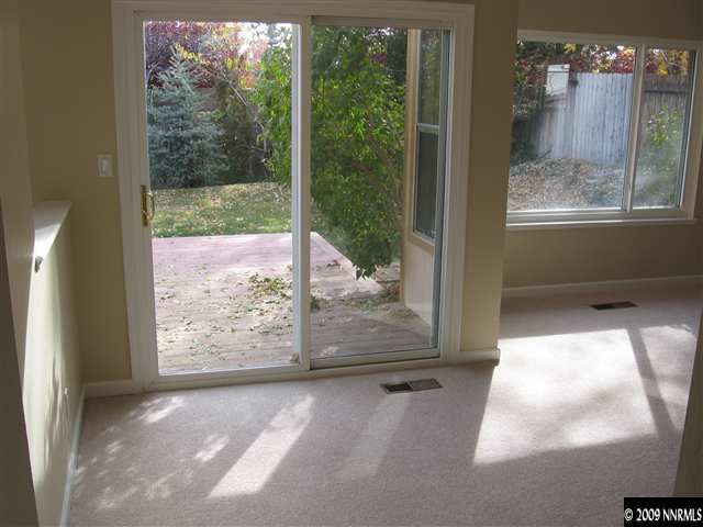 6154 Chesterfield Lane Reno, NV 89523 - Photo 3 of 9 a view of a glass door with a yard from a window