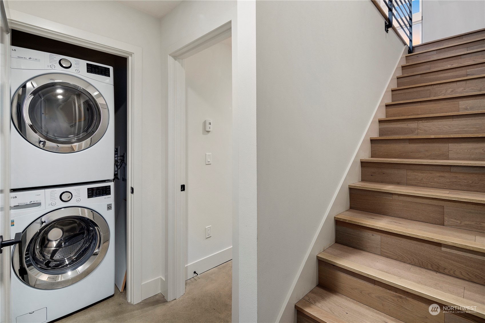 908 North 46th Street, Unit B Seattle, WA 98103 - Photo 10 of 32 a view of entryway with washer and dryer