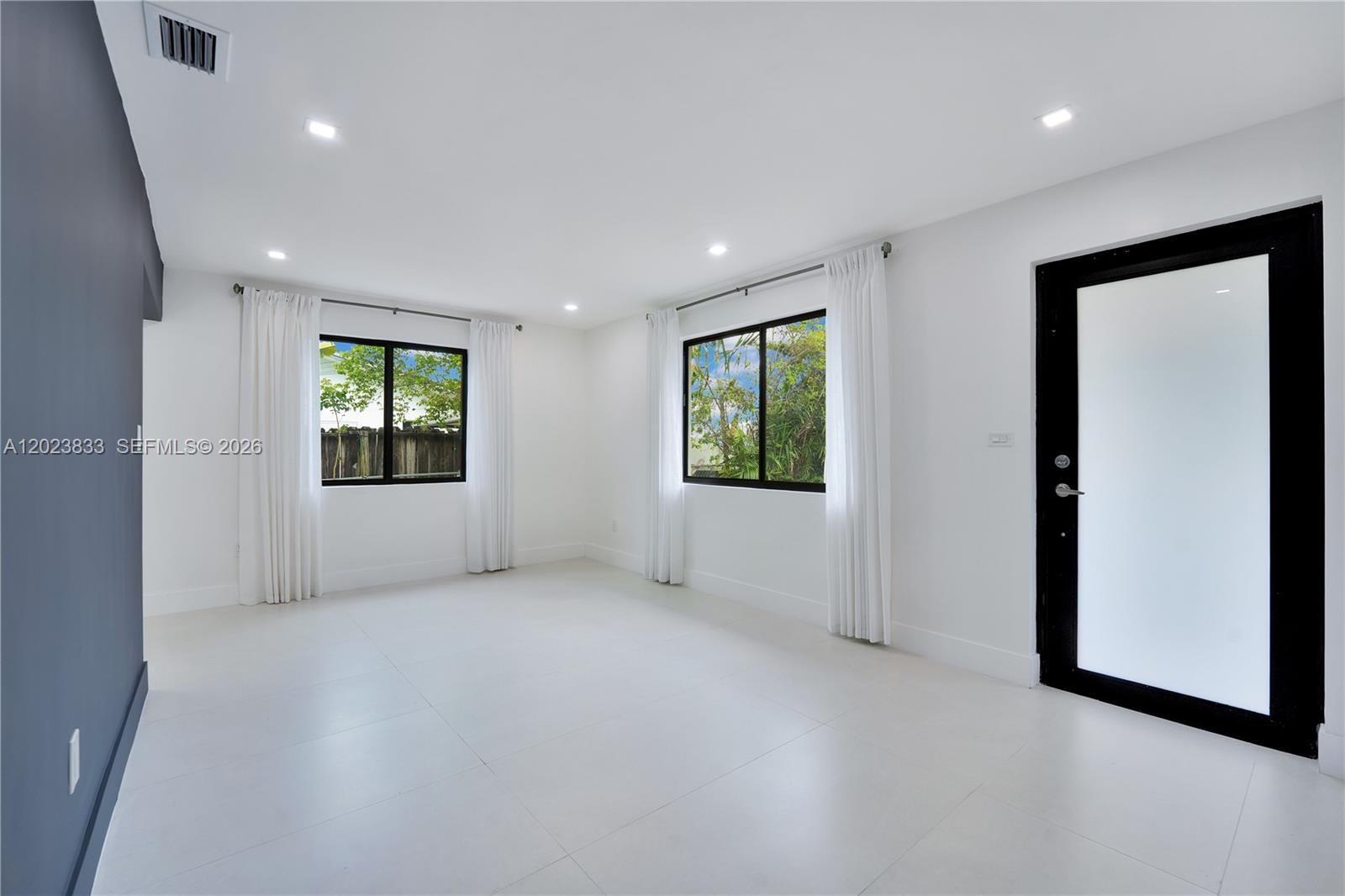 6566 Southwest 35th Street Miami, FL 33155 - Photo 7 of 36 an empty room with windows and closet