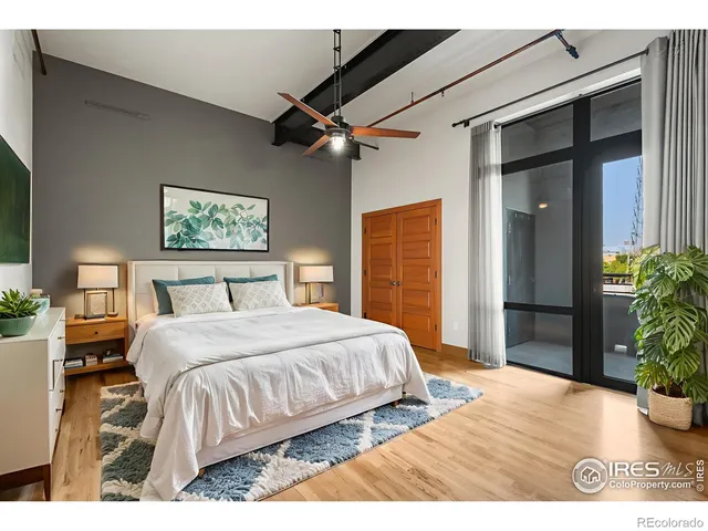 a bedroom with a bed dresser and a window