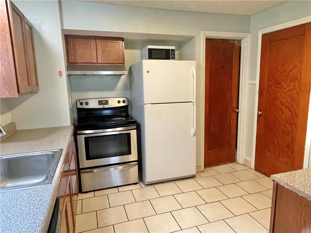 26 Raleigh Street Rochester, NY 14620 - Photo 5 of 19 Kitchen, with access to the first floor bedroom &