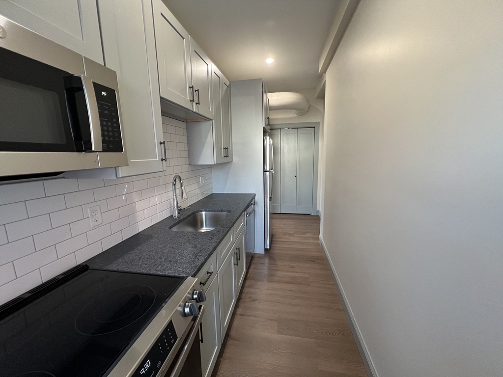 160 Seabury Street, Unit 8 Fall River, MA 02720 - Photo 1 of 13 a kitchen with stainless steel appliances granite countertop a sink and a stove
