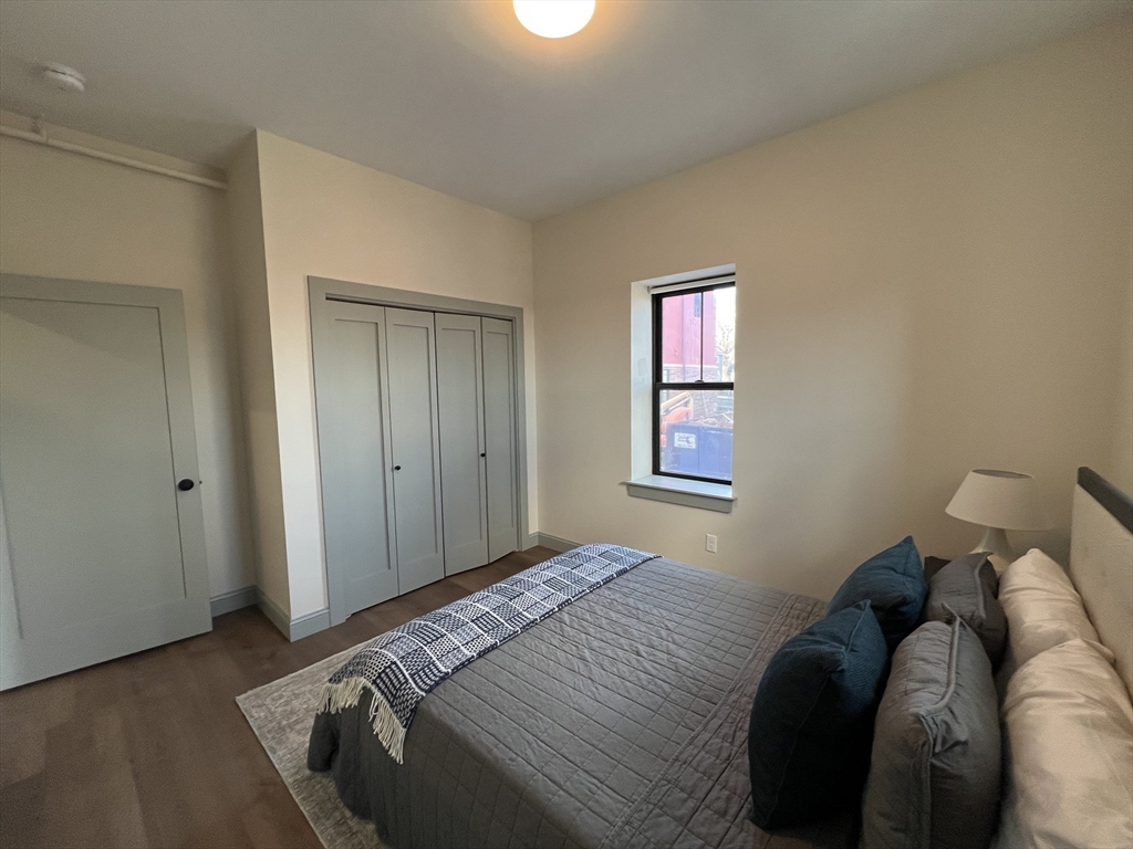 160 Seabury Street, Unit 8 Fall River, MA 02720 - Photo 11 of 13 a bedroom with a bed and a window