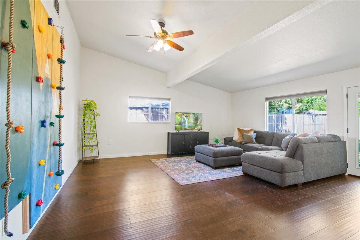 2041 Athens Avenue Redding, CA 96001 - Photo 13 of 36 a living room with furniture and a chandelier
