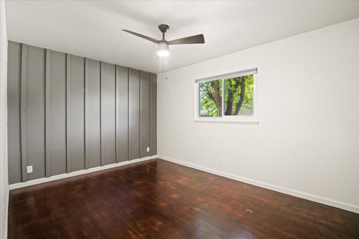 2041 Athens Avenue Redding, CA 96001 - Photo 23 of 36 an empty room with wooden floor closet and windows