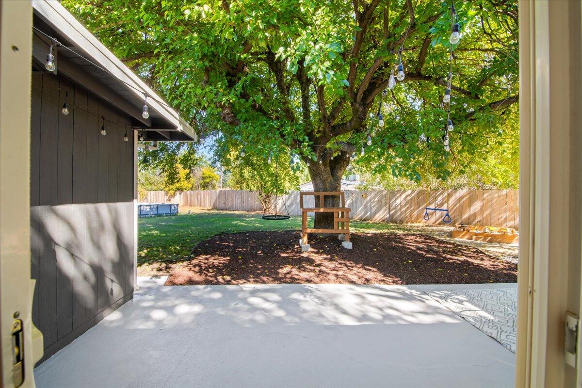 2041 Athens Avenue Redding, CA 96001 - Photo 30 of 36 a view of a yard with plants and trees
