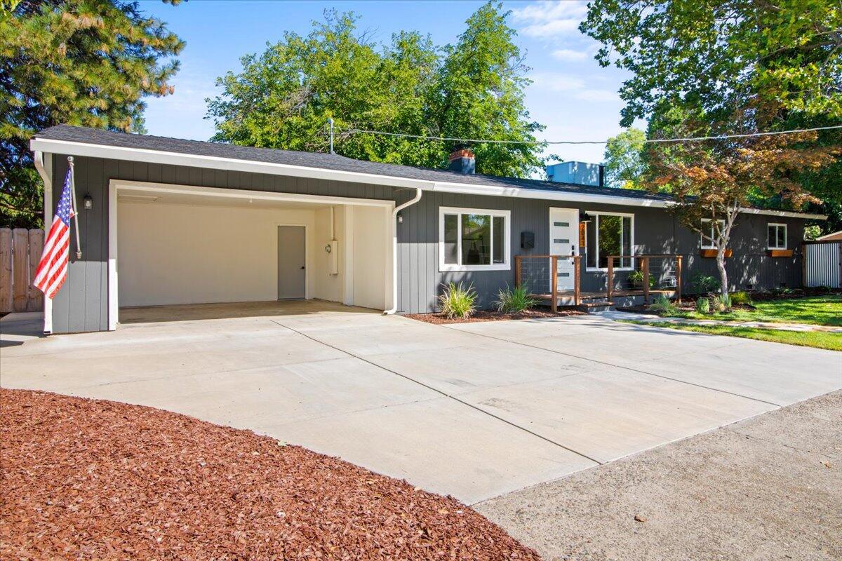 2041 Athens Avenue Redding, CA 96001 - Photo 3 of 36 a view of a backyard with a patio