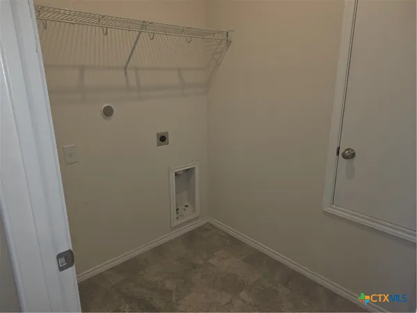 a bathroom with a granite countertop sink toilet and vanity