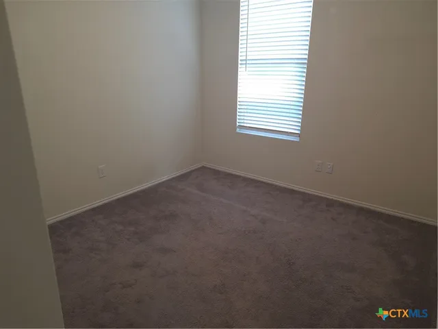 a view of a balcony with wooden floor