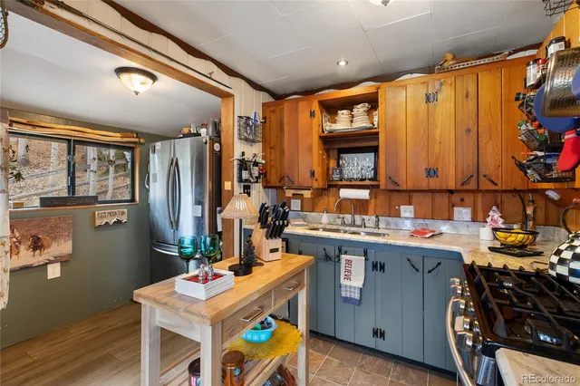 a room with furniture a rug and a window