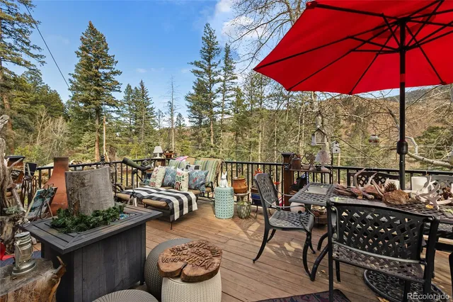 a view of a chairs and table in the patio