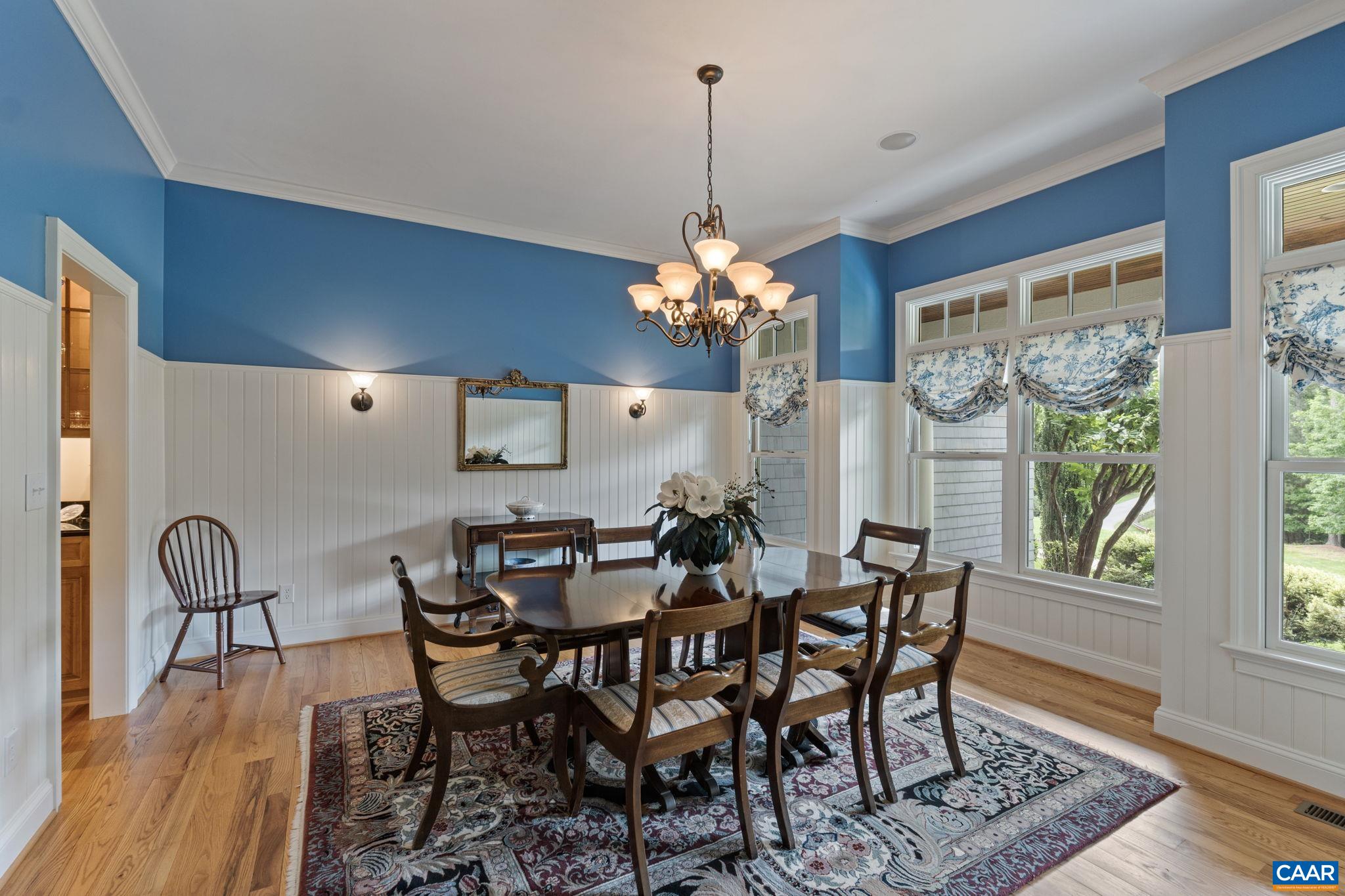 2025 Farringdon Road Keswick, VA 22947 - Photo 20 of 55 a dining room with furniture a chandelier and wooden floor