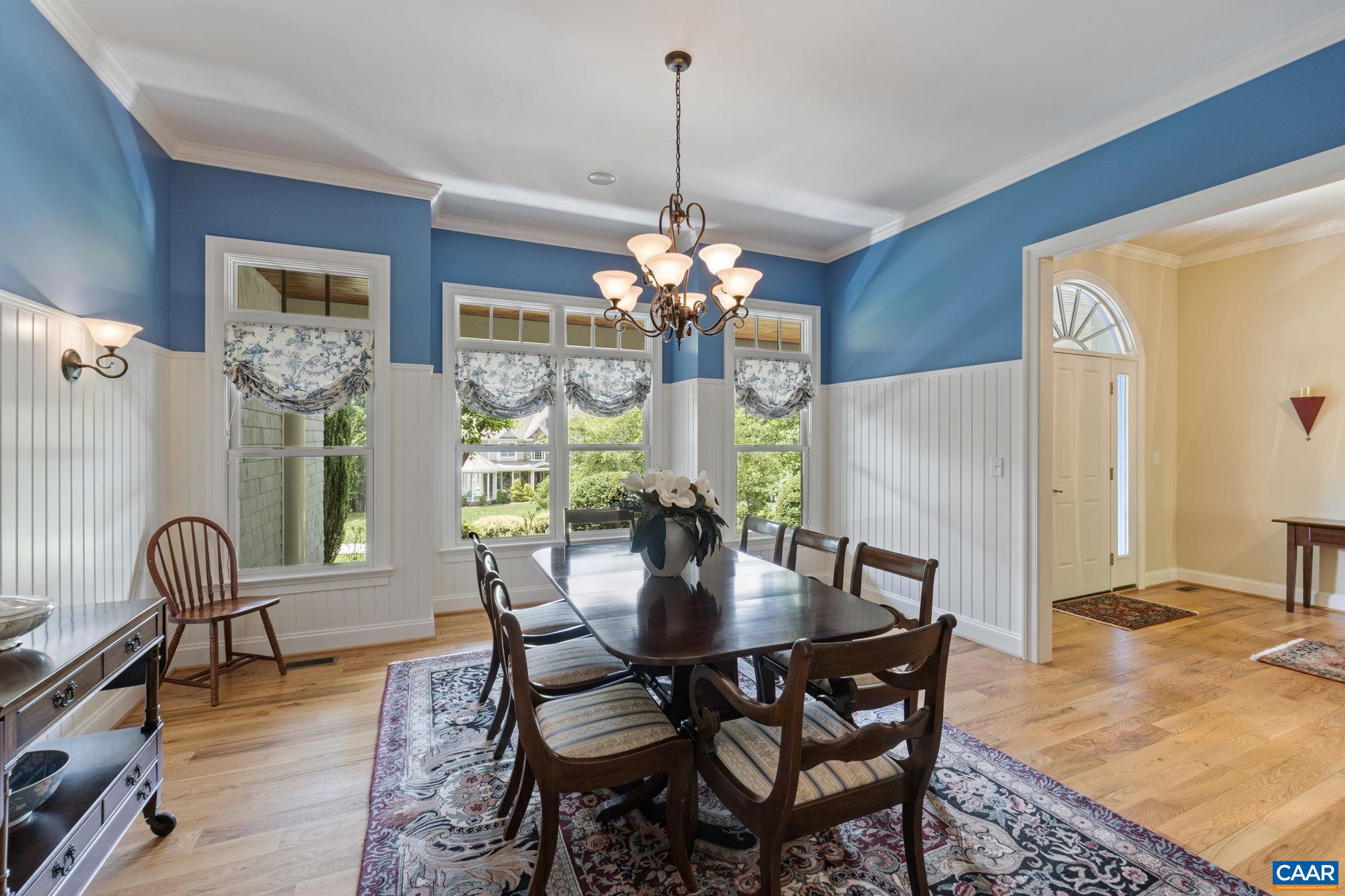 2025 Farringdon Road Keswick, VA 22947 - Photo 21 of 55 a dining room with furniture a chandelier and wooden floor