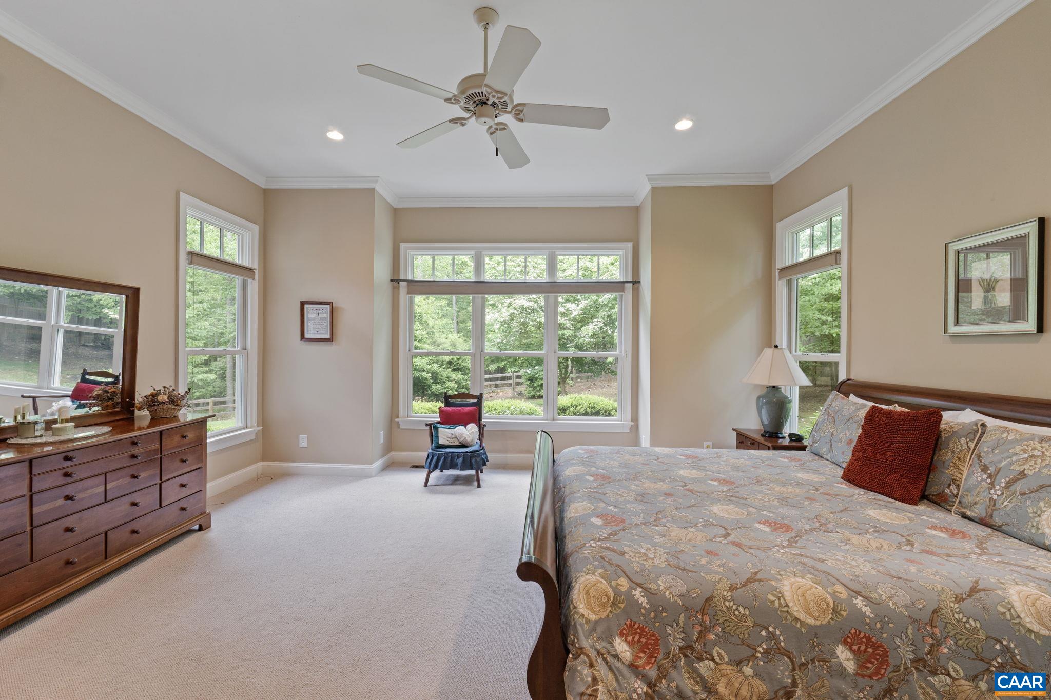 2025 Farringdon Road Keswick, VA 22947 - Photo 24 of 55 a bedroom with a large bed and a large window