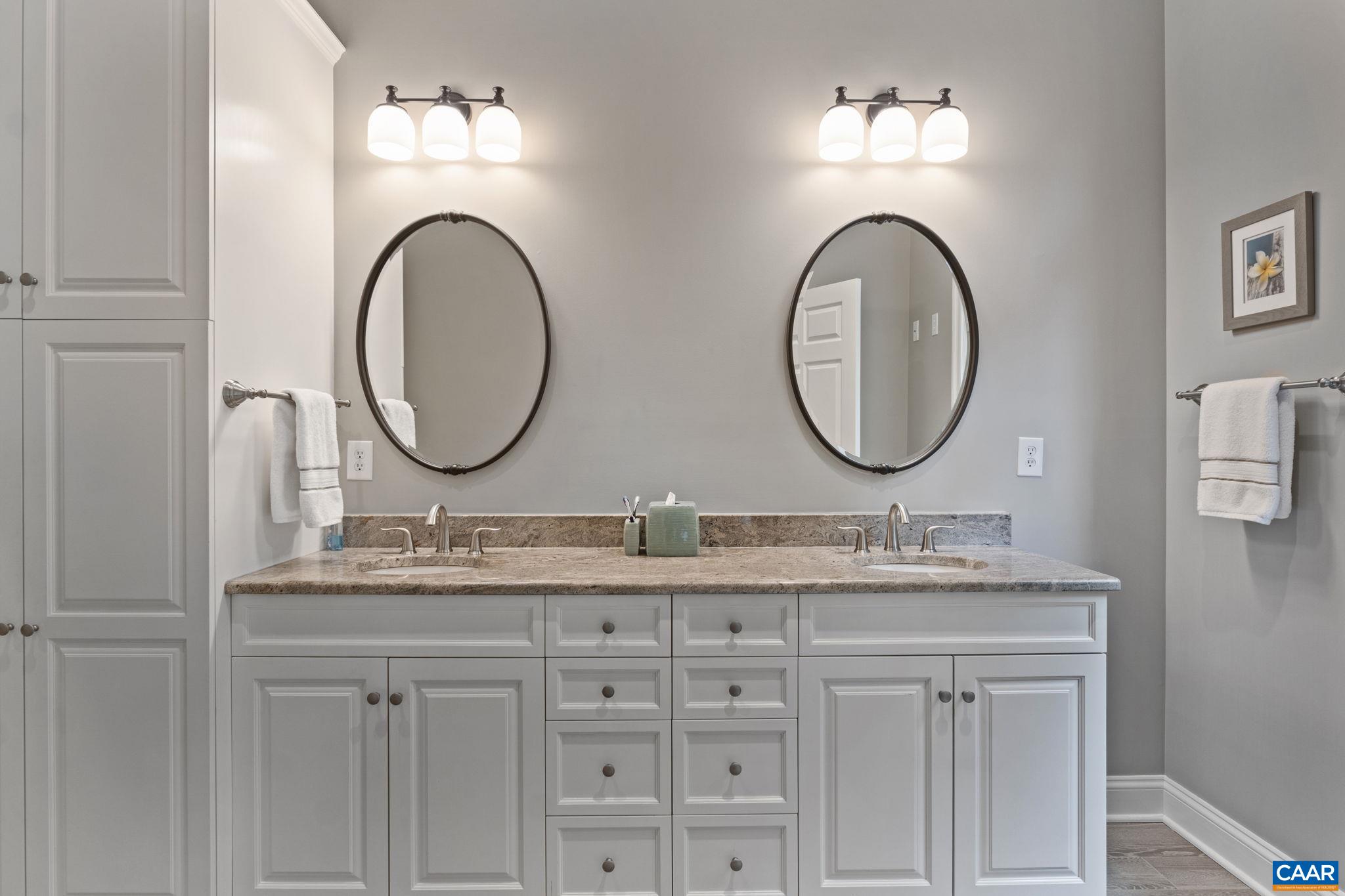 2025 Farringdon Road Keswick, VA 22947 - Photo 25 of 55 a bathroom with a granite countertop double vanity sinks and a mirror