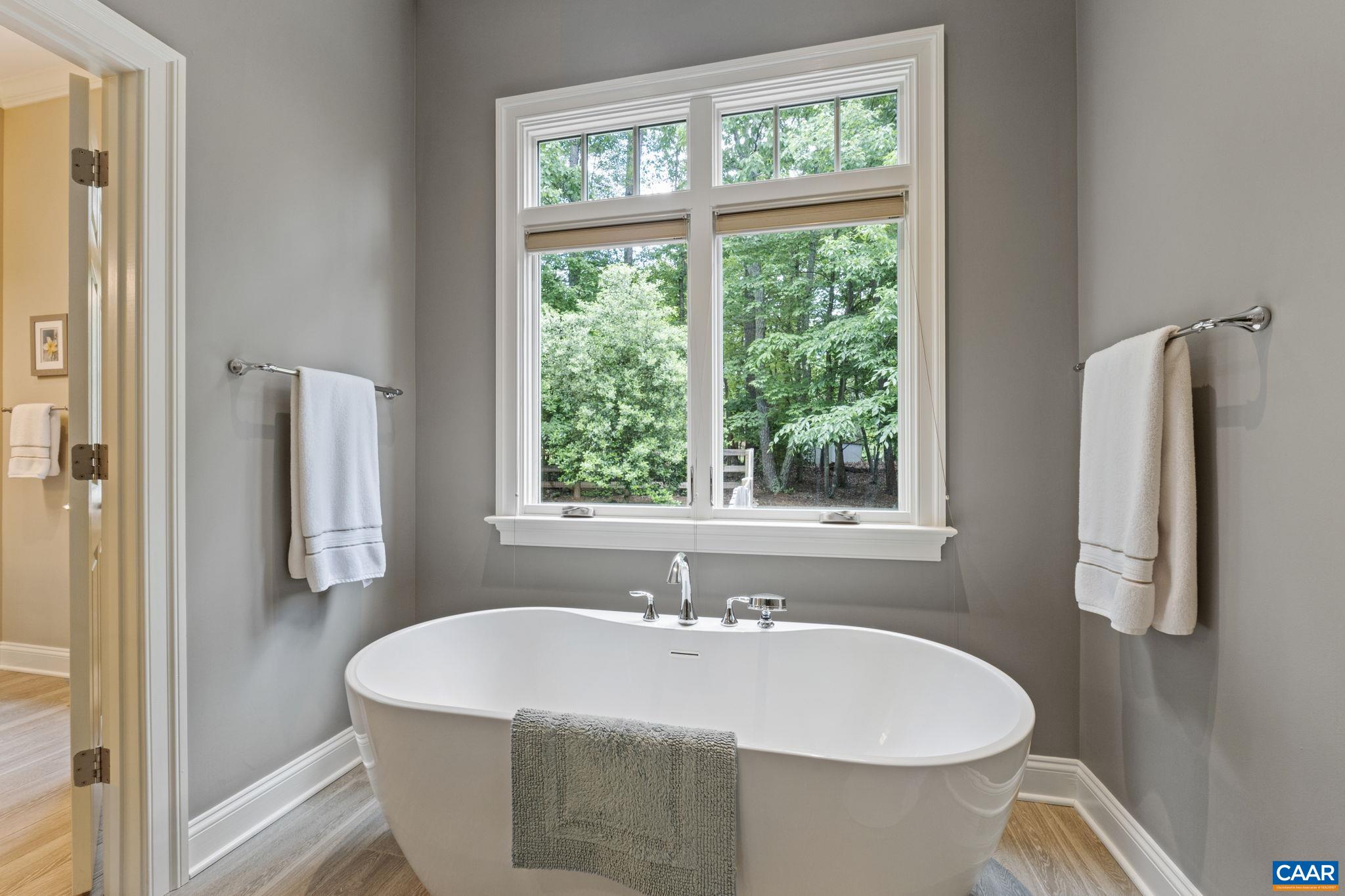 2025 Farringdon Road Keswick, VA 22947 - Photo 28 of 55 a white bath tub sitting next to a window