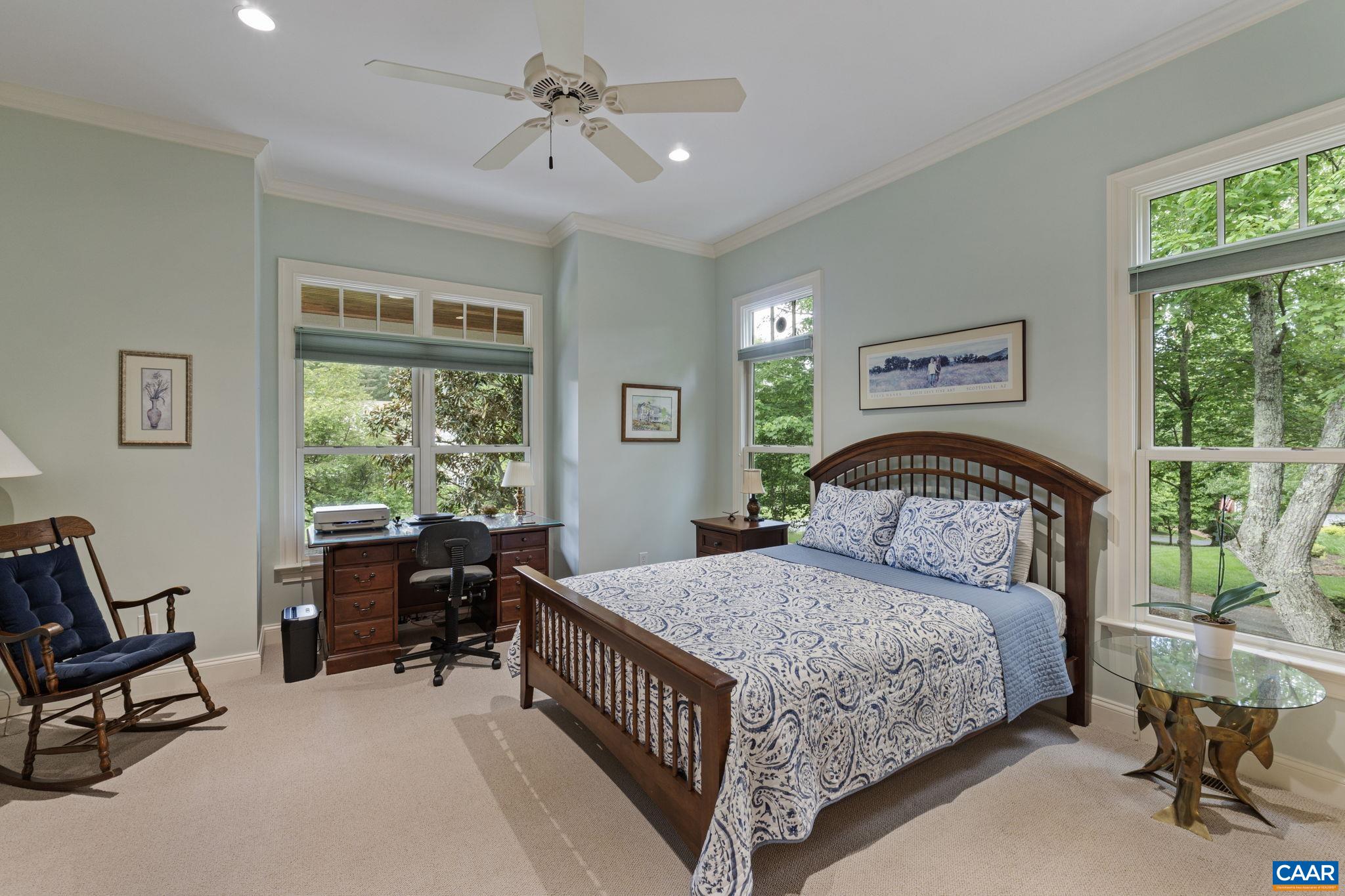 2025 Farringdon Road Keswick, VA 22947 - Photo 34 of 55 a bedroom with a bed a chair and a large window